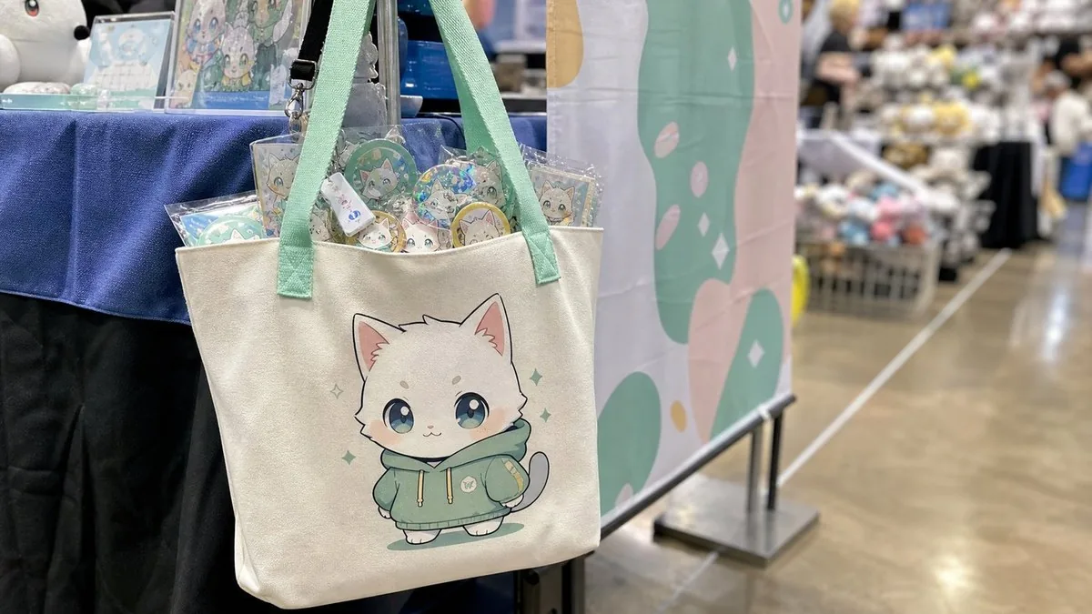 Tote filled with badges and charms at a convention stall