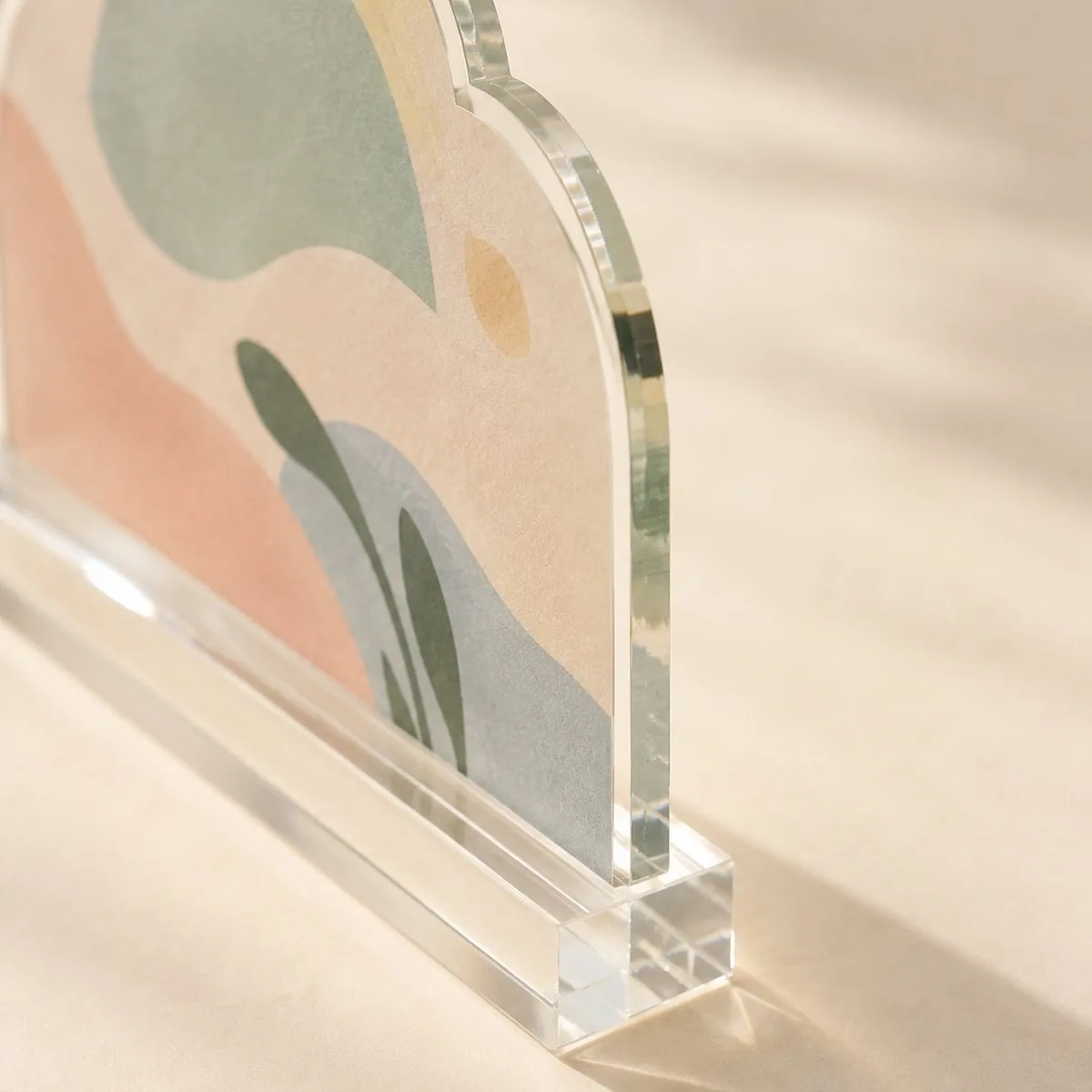 Standee in its clear base, raking light